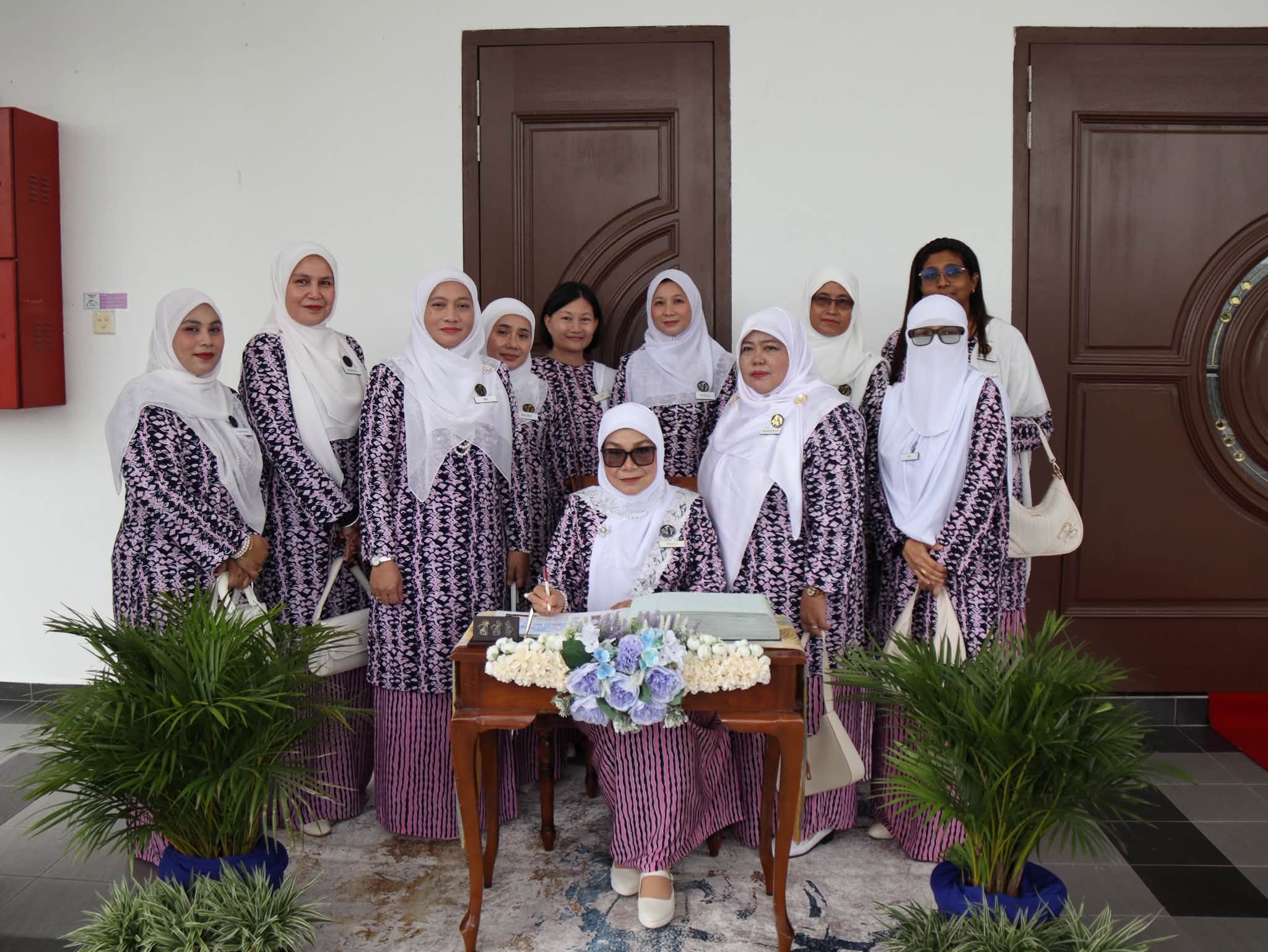 May be an image of one or more people, headscarf and dais