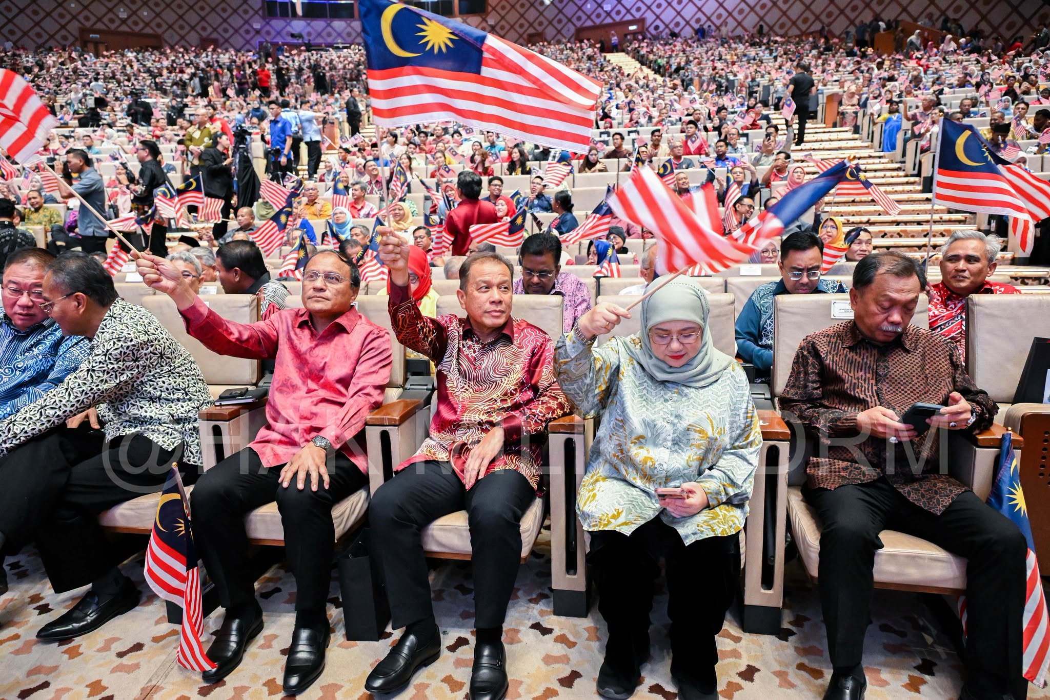 May be an image of one or more people and dais