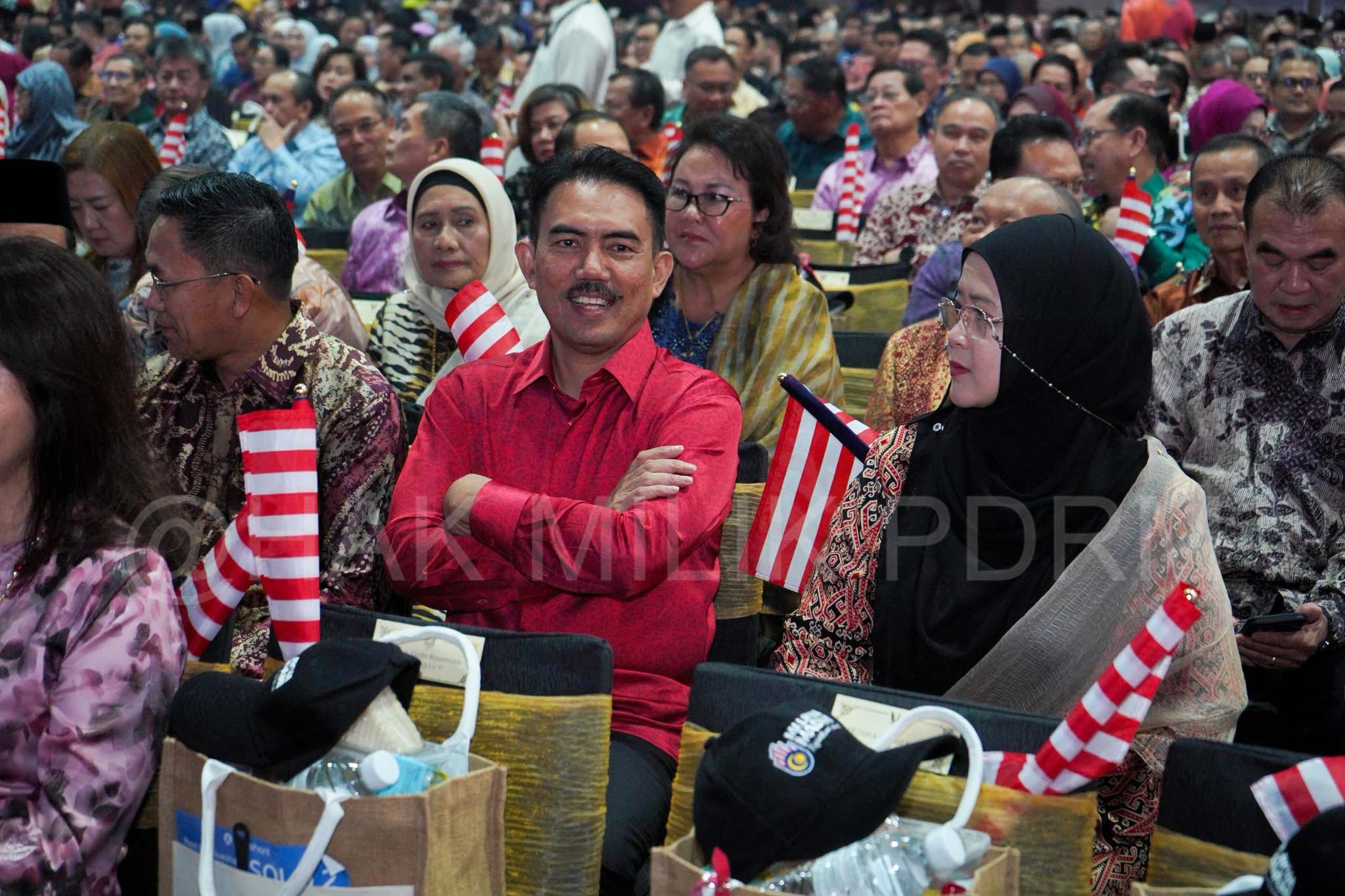 May be an image of one or more people, crowd and text