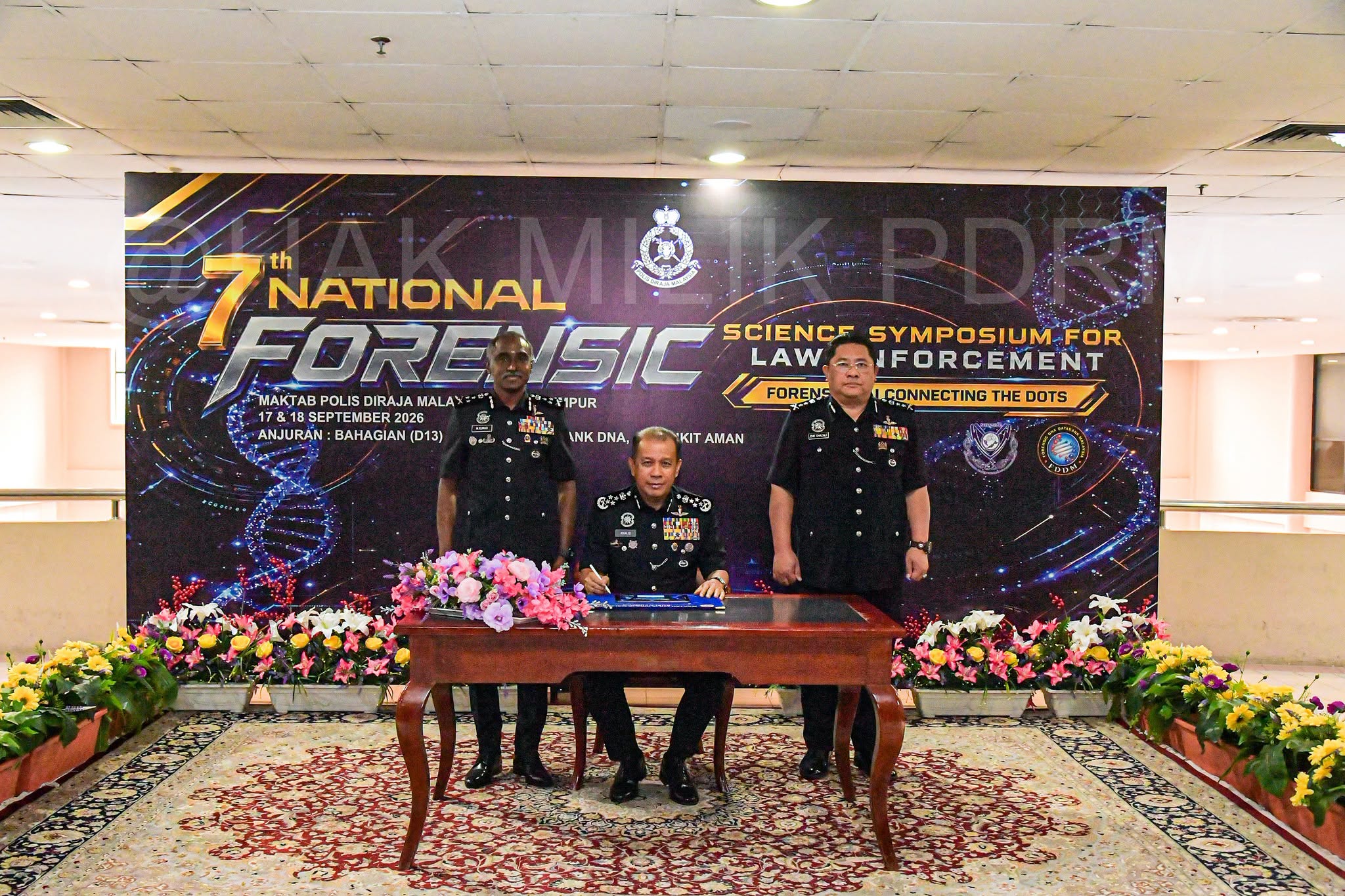 May be an image of dais and text that says 'FORENSIC FORE ISIC SCIENCF SYMPOSIUM-FOR 7NATIONAL th NATIONAL LAW. IFORÇEMENT MAKTAB POLIS DIRAJA FINAKTABPOL
