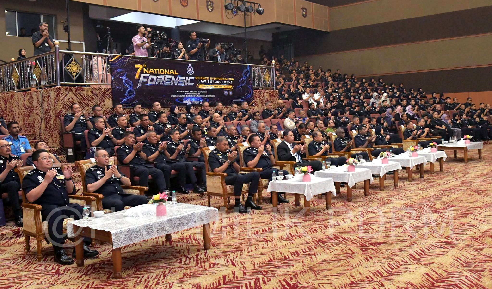 May be an image of table, crowd and text